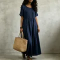 Close-up detail of a navy blue cotton linen pleated maxi dress featuring a relaxed casual fit - S / Dresses / Navy Blue