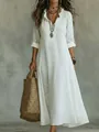 Elegant detail of a white ruffled V-neck maxi dress with intricate 3D floral embroidery. - S / Dresses / White