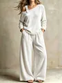 Elegante set due pezzi in velluto bianco crema con top monospalla e pantaloni a gamba larga. - Taglia S / Top E Pantaloni / Bianco
