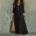 Elegant black long-sleeved maxi dress with subtle floral print and boho accessories - S / Dresses / Black