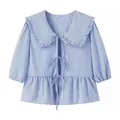 Stylish blue and white gingham blouse featuring a ruffled Peter Pan collar and bows - S / Tops / Blue