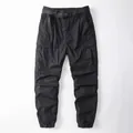 Black Japanese style multi-pocket cargo pants with adjustable belt and cuffed ankles. - XS / Bottoms / Black