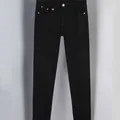 Premium black slim-fit jeans for men featuring a decorative gold bee metal emblem - 29 / Bottoms / Black