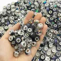 Hand holding mixed colors large hole beads for DIY charm bracelet jewelry making - Black Series
