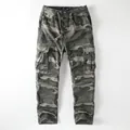 Vintage men's camouflage cargo pants featuring drawstring waist and multiple pockets. - S / Green Camouflage