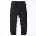 Vintage black cotton cargo pants with multiple pockets and loose straight fit - 38 / Black
