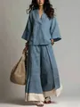 Conjunto bohemio de lino azul con top con cuello en V y pantalones anchos con dobladillo crema. - Azul Denim
