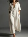Close-up detail of an elegant beige linen maxi dress with short sleeves and a collar - S / Dresses / Off White