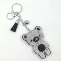 Dettaglio portachiavi orsetto di strass con nappa nera e hardware in metallo argentato. - Forma di orsetto / Base Nera Strass Bianco
