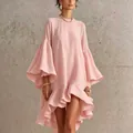 Detailed view of an elegant pink dress with dramatic bell sleeves and ruffled asymmetric hem - S / Dresses / Pink