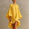 Detail view of yellow asymmetrical loose dress with elegant bell sleeves and ruffles - Gold