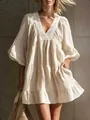 Detail view of the elegant lace V-neck and ruffled sleeves on this cream mini dress. - S / Dresses / Milky White