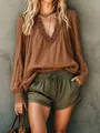 Detail showing the ruffled V-neck and cotton linen texture of this brown blouse. - Coffee