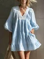 Detail view of light blue tiered vacation dress with delicate white lace V-neckline trim - Lake Blue