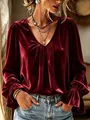 Detail of burgundy velvet shirt featuring a deep V-neck and pleated long sleeves. - S / Tops / Burgundy