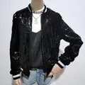 Detailansicht einer stylischen schwarzen Pailletten-Bomberjacke mit silbernen Streifenmanschetten - S / Oberteile / Schwarz