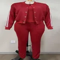 Front view of women's three-piece deep red tracksuit set with side stripes on a mannequin - 3XL / Set / Burgundy