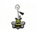 Porte-clés abeille scintillant en strass avec pompon noir et clochette argentée - Abeille à Gland