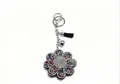Porte-clés fleur en strass étincelants avec cristaux colorés et pompon noir élégant - Fleur de Couleur Mixte à Gland