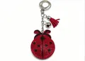 Porte-clés coccinelle en strass rouges avec pompon rouge et clochette argentée - Scarabée à Gland