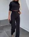 Elegante conjunto de dos piezas negro para mujer con top corto y pantalones de talle alto - S / Parte Superior y Parte Inferior / Negro