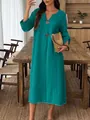 Detail of a teal cotton linen maxi dress with a V-neck and decorative buttons - S / Dresses / Cyan