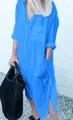 Detail view of an elegant blue maxi shirt dress with side slits and pockets. - S / Dresses / Light Blue