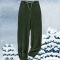 Detail view of warm dark green fleece jogger pants with cozy texture for winter lounging - S / Bottoms / Green