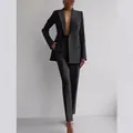 Elegant professional black double-breasted blazer and trousers suit set for modern women - S / Black
