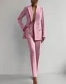 Elegant pink two-piece professional suit featuring double-breasted blazer and trousers - Pink
