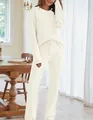 Detailed view of women's warm fuzzy loungewear set with round neck and long pants. - XS / Top And Bottom / Beige