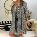 Detailed shot of the daisy floral print and loose ruffle sleeves on this casual dress - S / Dresses / Black
