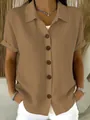 Detail of a casual khaki short-sleeve cotton linen shirt with wooden buttons - Khaki
