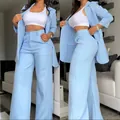Elegant light blue two-piece blazer and wide-leg trousers suit set for modern women. - S / Top And Bottom / Blue