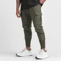 Detailed view of olive green cargo joggers featuring a large side pocket and ribbed cuffs - S / Bottoms / Army Green