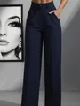 Detail view of high-waisted navy blue straight-leg trousers with pleated waist design - S / Bottoms / Navy Blue