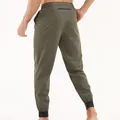Pantalon de jogging sport vert olive pour hommes avec poche arrière zippée et ourlet - Vert Militaire