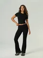 Black two-piece yoga set with short sleeve crop top and high-waisted flared leggings - S / Top And Bottom / Black
