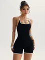 Black one-piece yoga bodysuit with white contrast trim and sleek cross-back straps - S / Set / Black
