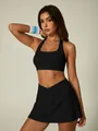 Women's black halter neck sports bra and cross high waist tennis skirt 2-piece set - S / Top And Bottom / Earth Black