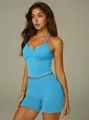 Blue athletic yoga set featuring a halter neck top and tight high-waist shorts - S / Top And Bottom / Glacier Blue