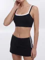 Black two-piece yoga set featuring double-strap sports bra and side-striped mini tennis skirt - S / Top And Bottom / Black