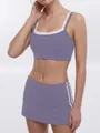 Purple sports yoga set featuring a double-strap bra and matching side-striped skort - S / Top And Bottom / Violet