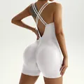 White backless yoga jumpsuit with criss-cross straps and ribbed fabric texture. - S / Yoga Unitard / Pure White