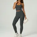 Two-piece dark grey halter neck yoga set with padded crop top and high-waist leggings - S / Top And Bottom / Dark Gray