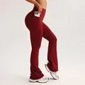 Red high waist flare yoga pants with side pockets and peach lift slimming design - Burgundy