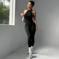 Sleek black sleeveless bodycon yoga jumpsuit with high neck and backless design for women - S / Dresses / Black