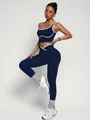 Women's two-piece navy blue yoga set featuring a sports bra and high-waist leggings - S / Top And Bottom / Navy Blue