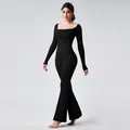 Elegant black long sleeve yoga jumpsuit for fitness with stylish flare leg design - S / Set / Black