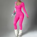 Combinaison de yoga rose néon à manches longues côtelée avec une coupe athlétique moulante - Rose rouge